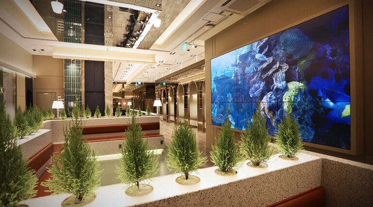 reception desk, waiting room in the lobby with a big screen showing beautiful nature.